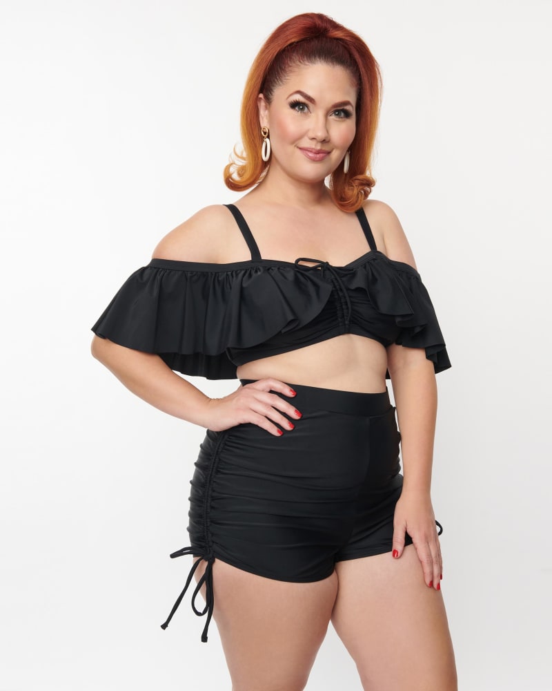 Front of a model wearing a size 1X/16 Unique Vintage Plus Size Black Ruffle Swim Top Full Sleeve in Black by Unique Vintage. | dia_product_style_image_id:269616